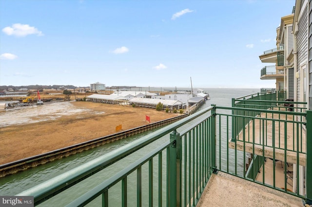 balcony featuring a water view