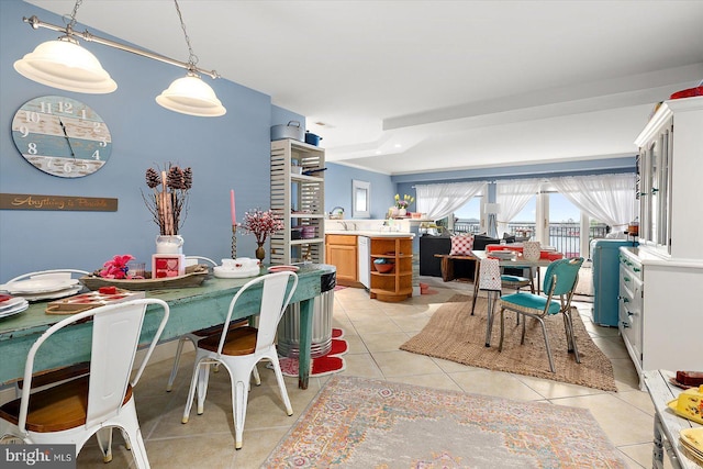 dining space featuring light tile patterned flooring