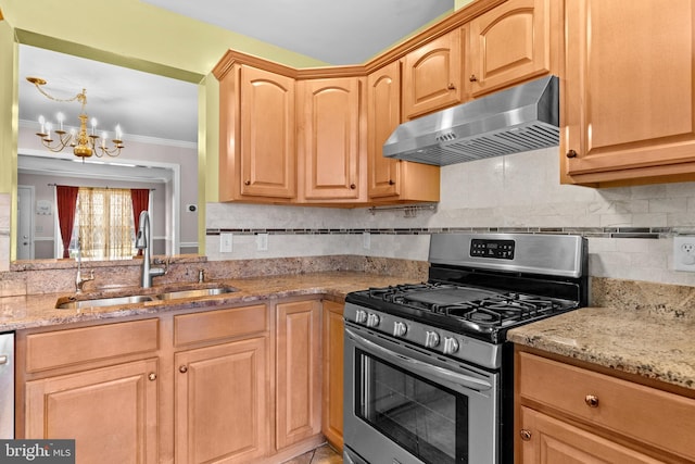 kitchen with sink, light stone counters, an inviting chandelier, appliances with stainless steel finishes, and range hood