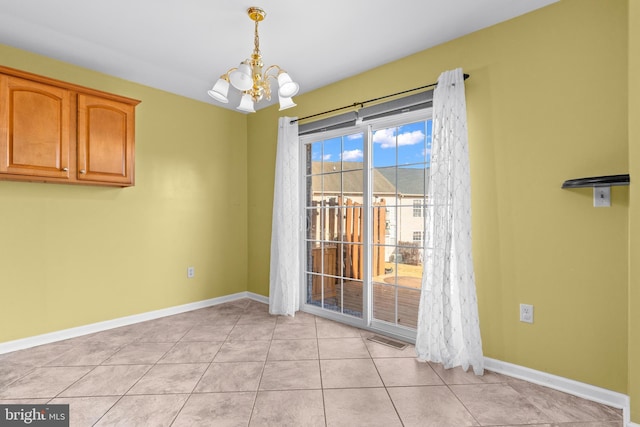 unfurnished dining area with light tile patterned floors and a chandelier