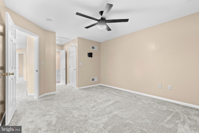 unfurnished room featuring light carpet and ceiling fan