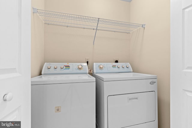 washroom with separate washer and dryer