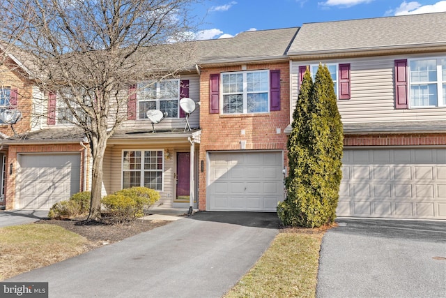 townhome / multi-family property featuring a garage