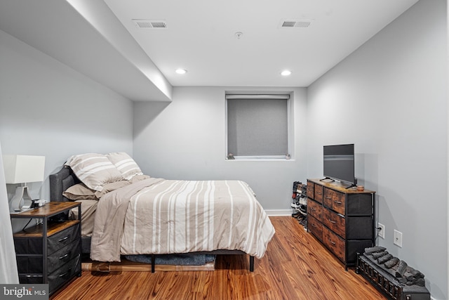 bedroom featuring light hardwood / wood-style floors