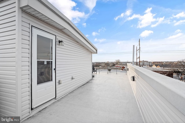 view of patio featuring a balcony