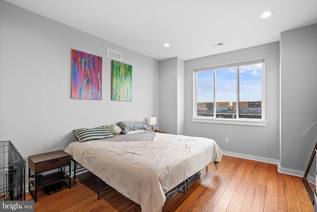 bedroom with hardwood / wood-style floors