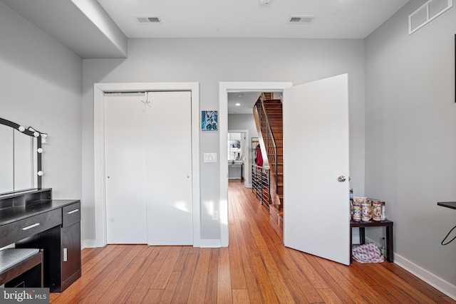 interior space with light wood-type flooring and a closet