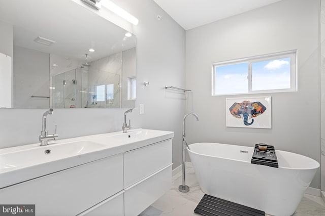 bathroom featuring vanity and shower with separate bathtub