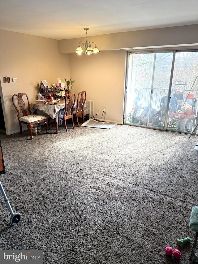 dining space with an inviting chandelier and carpet