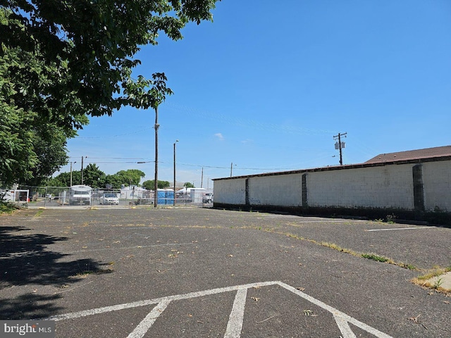 uncovered parking lot with fence