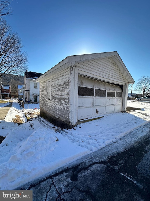 view of snow covered garage