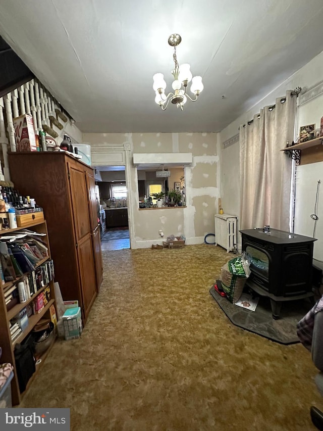 living room with an inviting chandelier and radiator