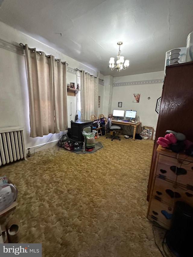 interior space featuring carpet floors, radiator, and an inviting chandelier