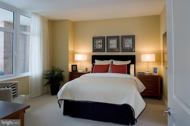 bedroom featuring light carpet