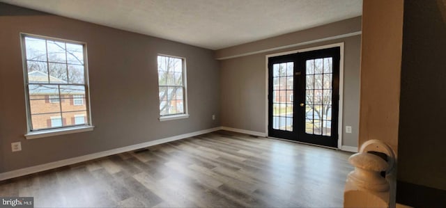 interior space featuring hardwood / wood-style floors and french doors