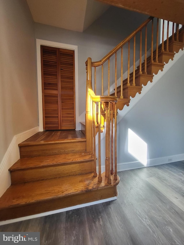 stairs with wood-type flooring