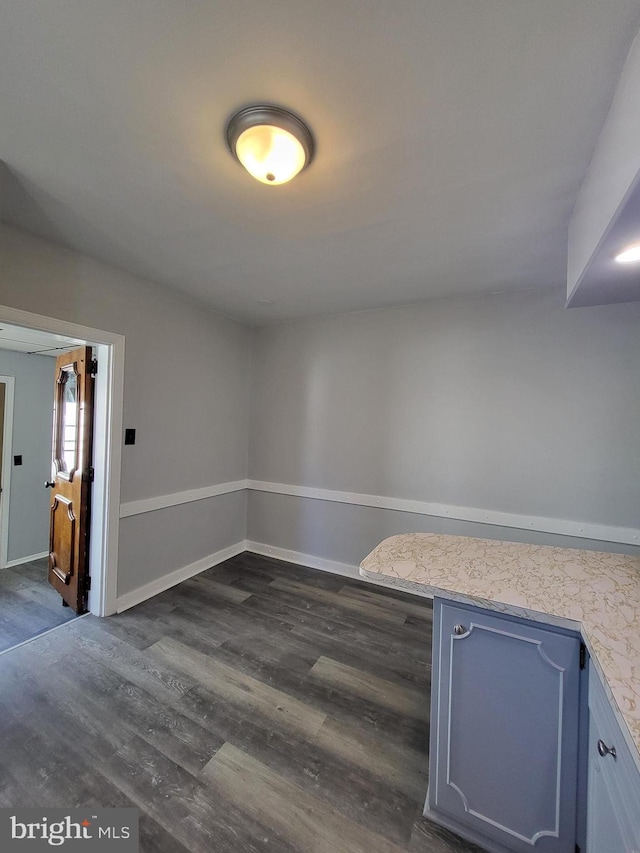 unfurnished room featuring dark hardwood / wood-style floors