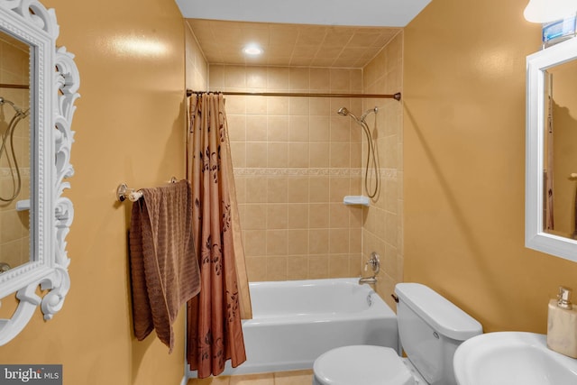 bathroom featuring shower / bath combination with curtain and toilet