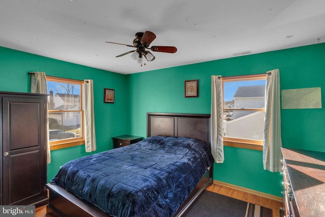 bedroom featuring hardwood / wood-style flooring and ceiling fan