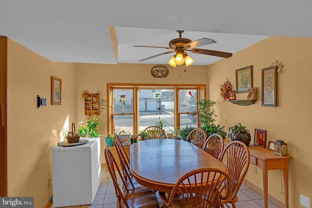 dining room featuring ceiling fan and light tile patterned flooring