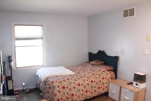 bedroom featuring dark hardwood / wood-style floors