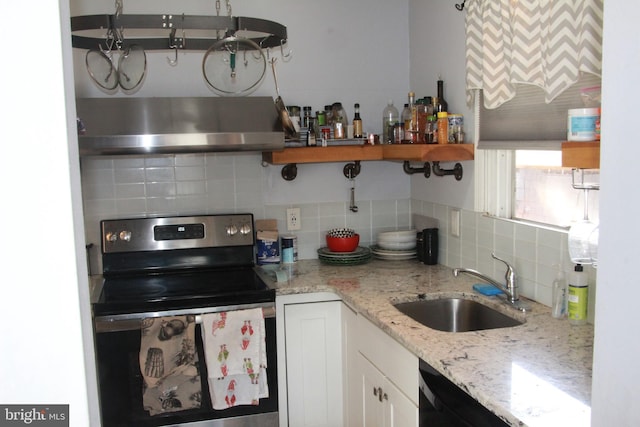 kitchen featuring sink, white cabinets, exhaust hood, light stone countertops, and stainless steel electric range