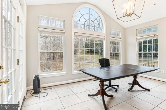 office featuring a notable chandelier, light tile patterned floors, visible vents, high vaulted ceiling, and baseboards