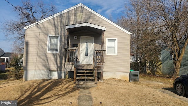 view of front of house with fence and cooling unit