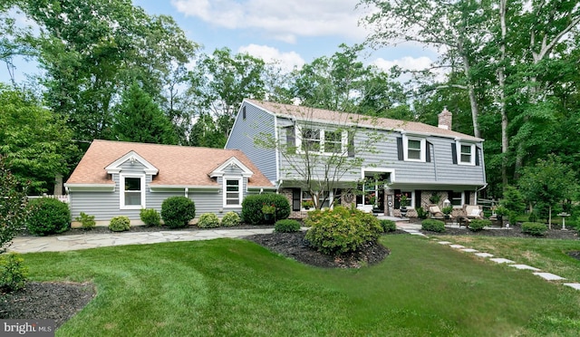 view of front of home with a front yard