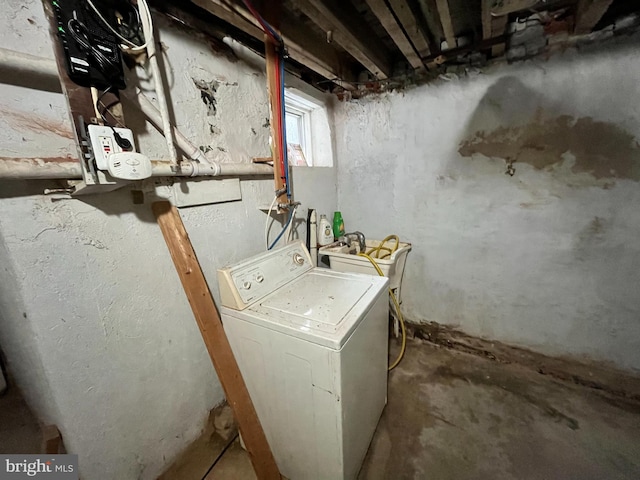 laundry room featuring washer / clothes dryer and sink