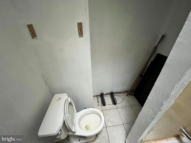 bathroom with tile patterned floors and toilet