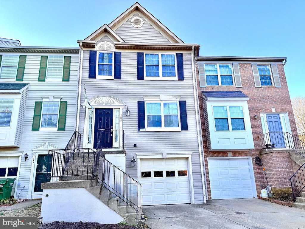 multi unit property featuring a garage