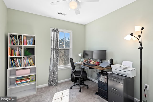 carpeted office with visible vents, ceiling fan, and baseboards