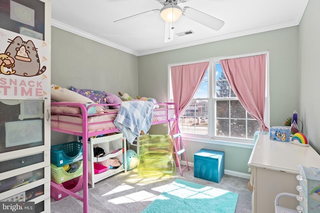 bedroom featuring carpet floors, visible vents, a ceiling fan, baseboards, and ornamental molding