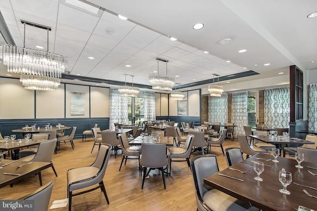 dining space with light hardwood / wood-style floors