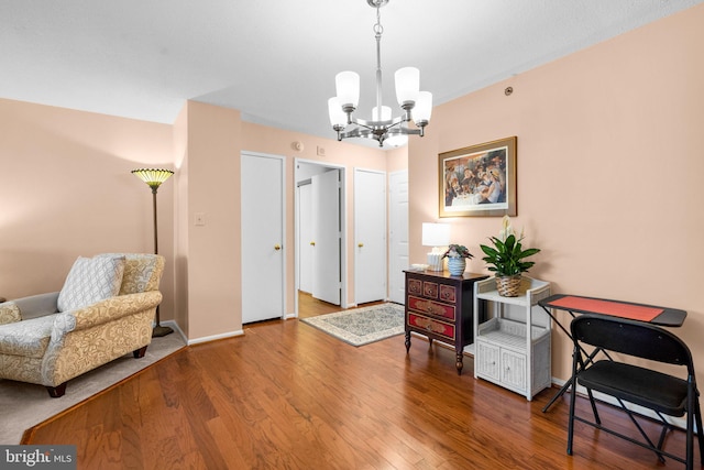 office space featuring a chandelier and hardwood / wood-style floors