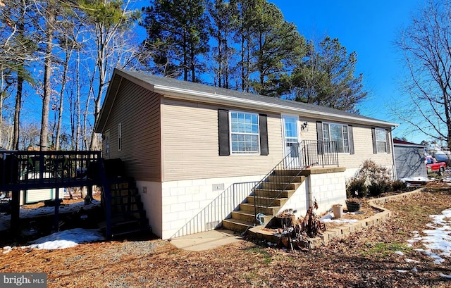 view of front of home with crawl space