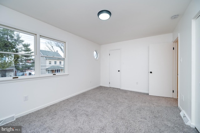 unfurnished bedroom with carpet floors