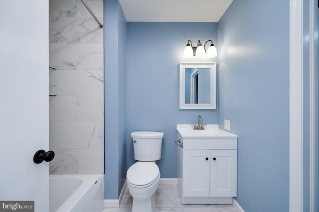 full bathroom with vanity, tiled shower / bath, and toilet