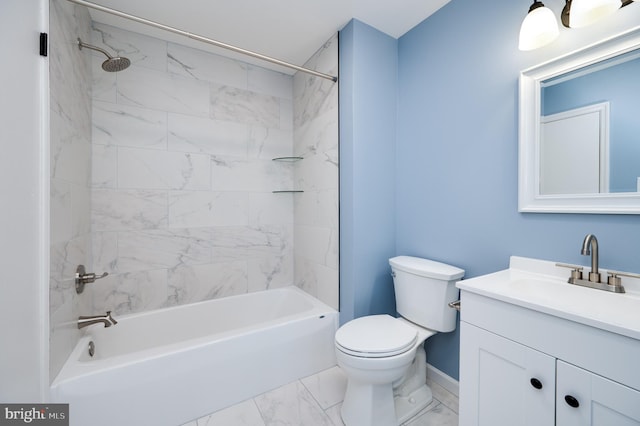 full bathroom with tiled shower / bath, vanity, and toilet