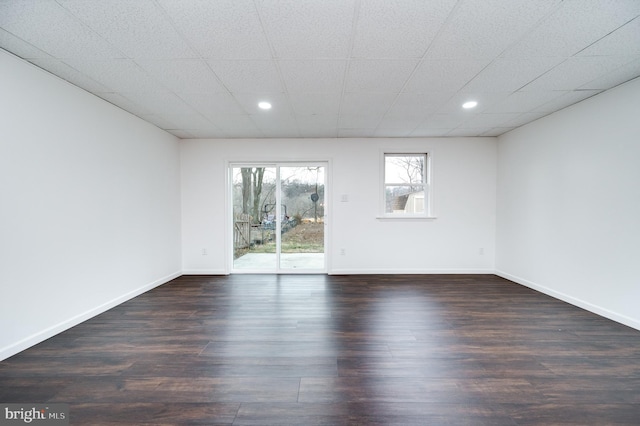 spare room featuring dark hardwood / wood-style floors