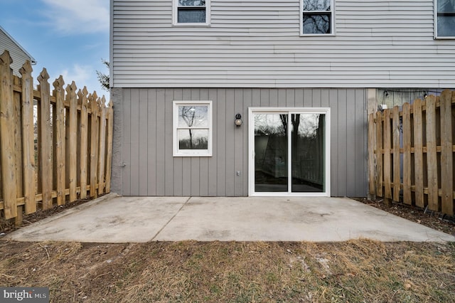 view of exterior entry featuring a patio