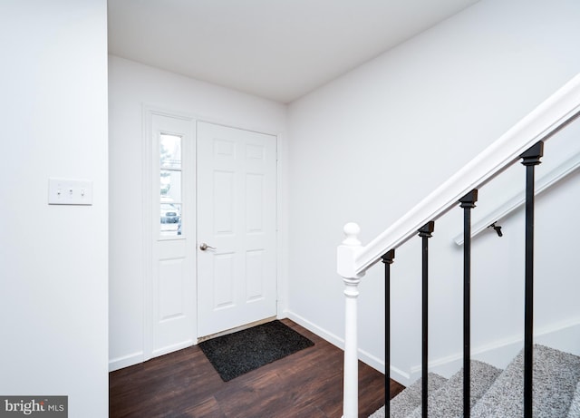 foyer with dark wood-type flooring