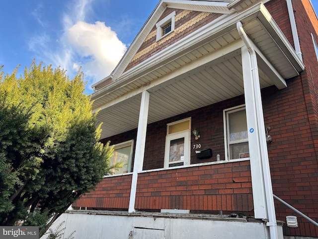 view of property exterior with covered porch