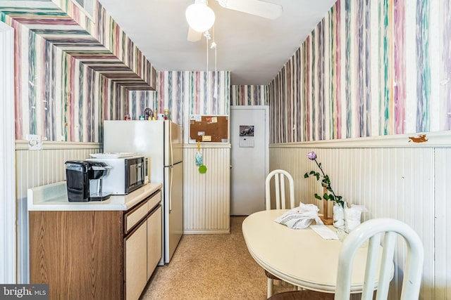 kitchen with ceiling fan and white refrigerator