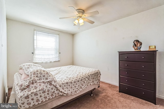 bedroom with ceiling fan and light colored carpet