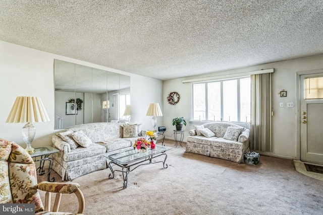 carpeted living room with a textured ceiling