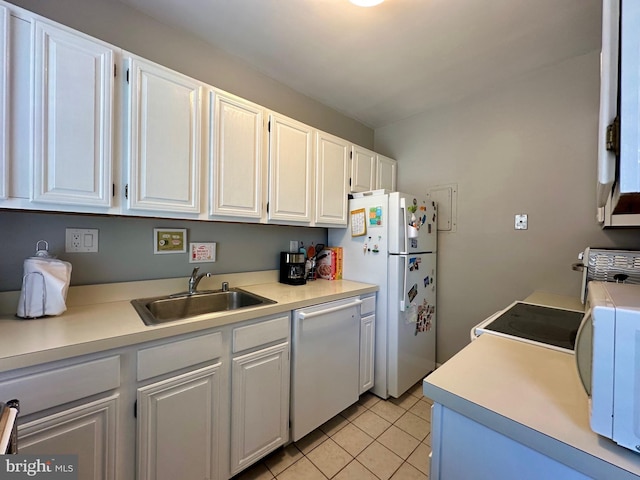 kitchen featuring a sink, white cabinetry, white appliances, light tile patterned flooring, and light countertops