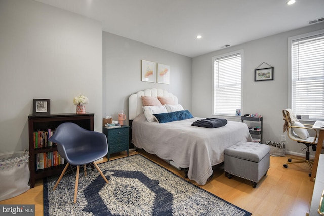 bedroom featuring visible vents, recessed lighting, baseboards, and wood finished floors