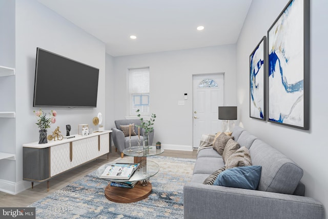 living room featuring light wood-type flooring, recessed lighting, and baseboards